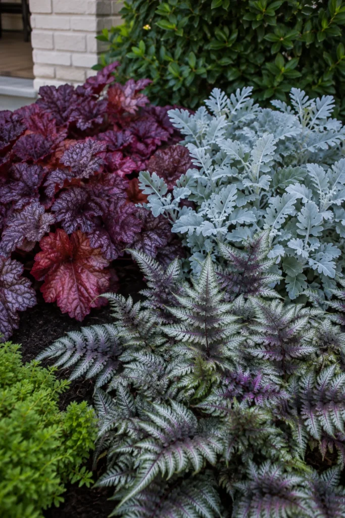 Mixed foliage and seasonal annuals in a bungalow front yard bed